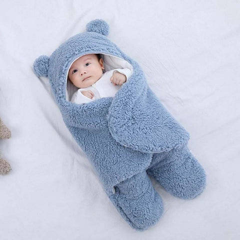 Baby sleeping soundly in a fluffy sleeping bag