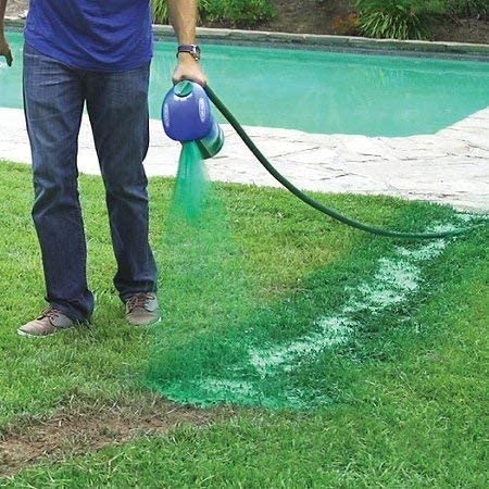 Applying liquid grass seed spray to a lawn