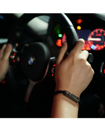 Charging cable bracelet wrapped around a wrist