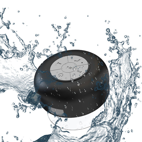 Waterproof shower speaker attached to a tiled wall